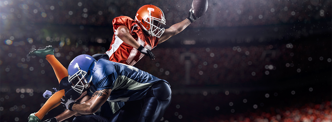 Football Players Playing in Big Game