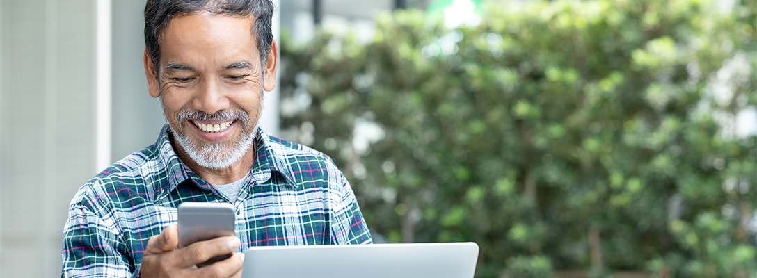 Man Checking Sports Handicappers on Social Media