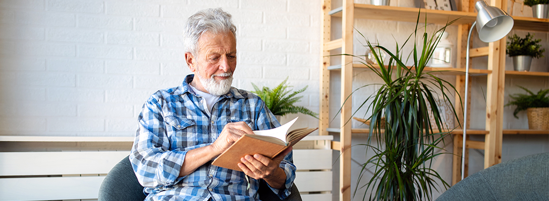 Man Reading Book About Football