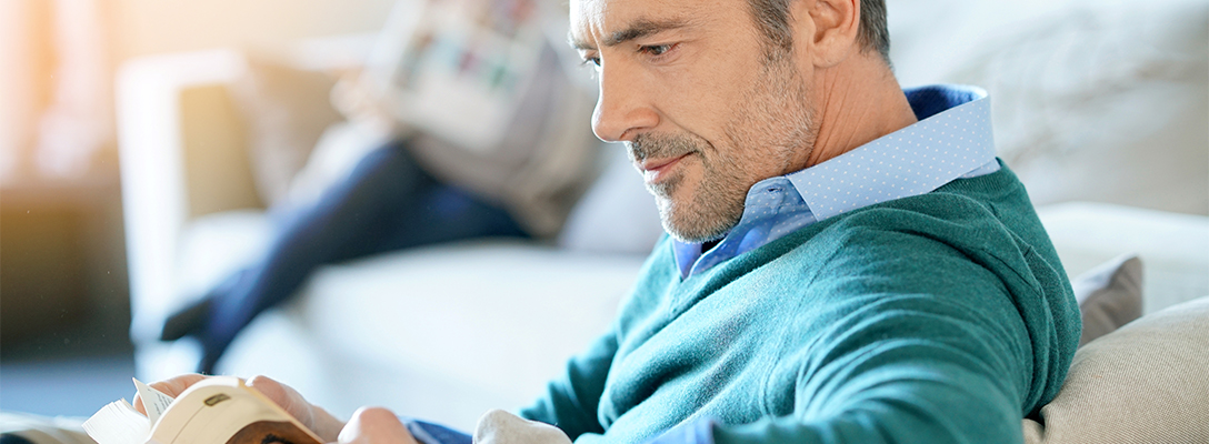 Man Reading Books About Sports