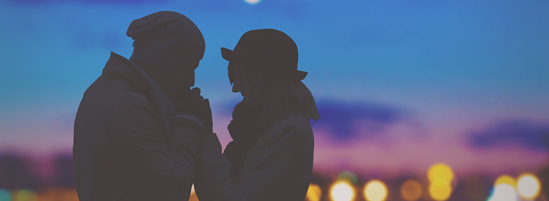 Couple Holding Hands with Scenic Vegas Lights in Background