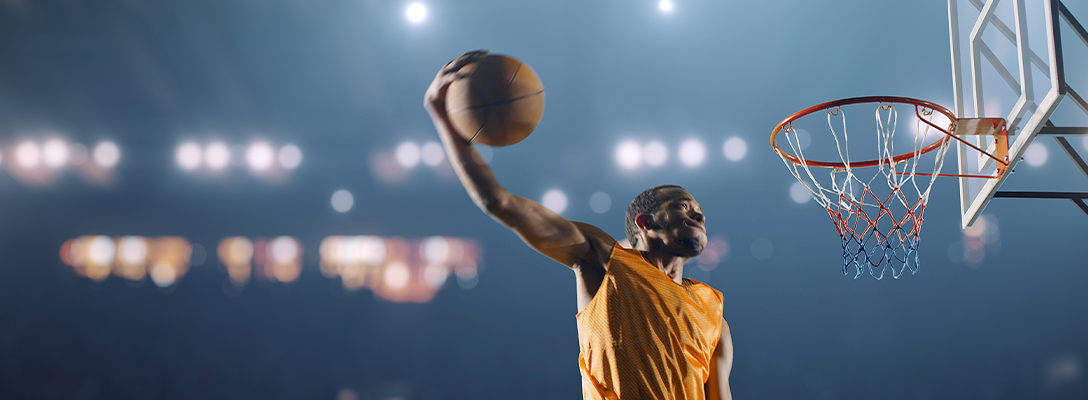 Basketball Player Doing Slam Dunk During Game