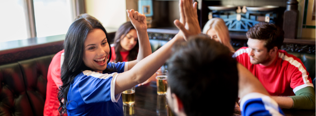 Friends Playing Sports Trivia in Bar