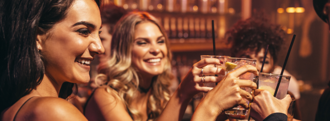 Girlfriends Clinking Glasses at a Bar in Las Vegas