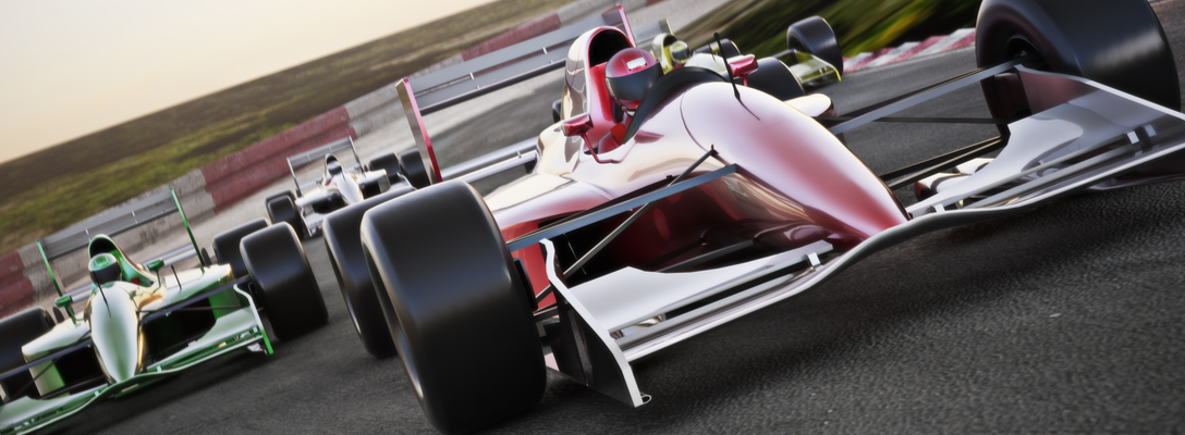 Formula 1 Race Cars on Racetrack During Race