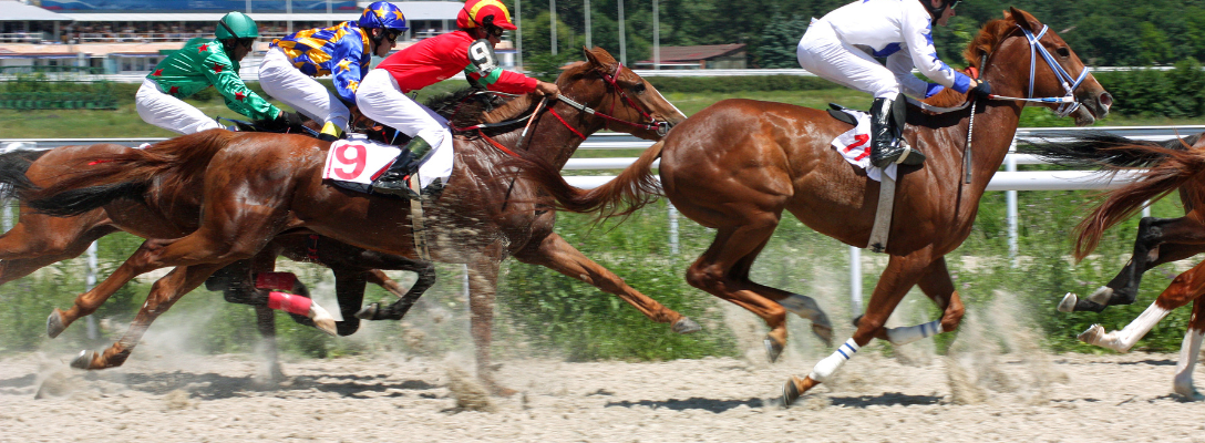 Jockeys and Horses Racing in Derby