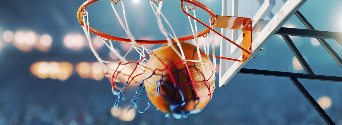 Basketball in Hoop During Professional Game