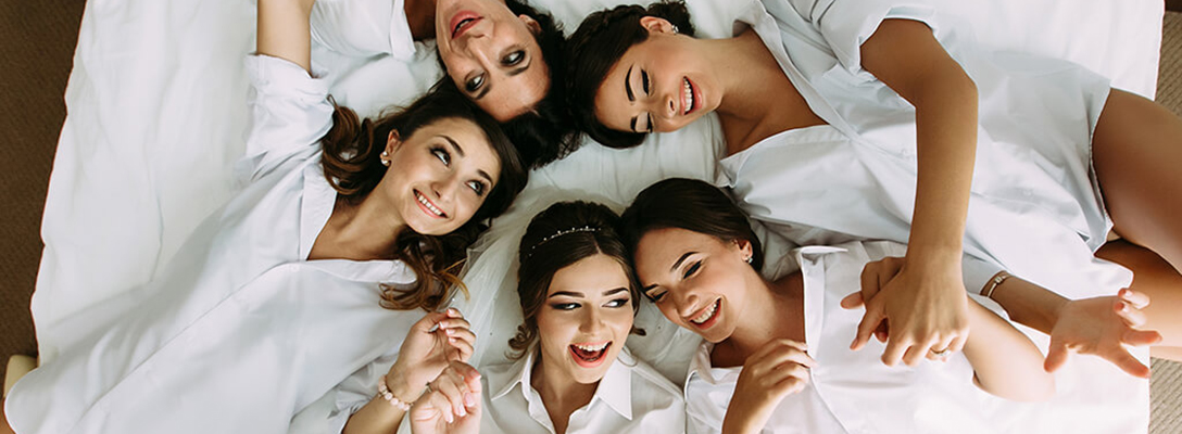 Bachelorette Party Laying on Bed in Las Vegas Hotel Room
