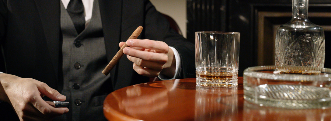 Person Holding Cigar at Las Vegas Cigar Bar